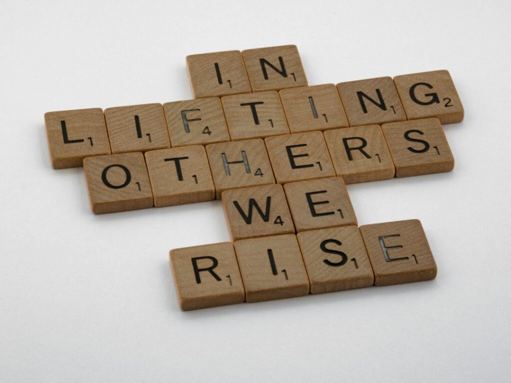 In lifting others, we rise. Motivational quote.