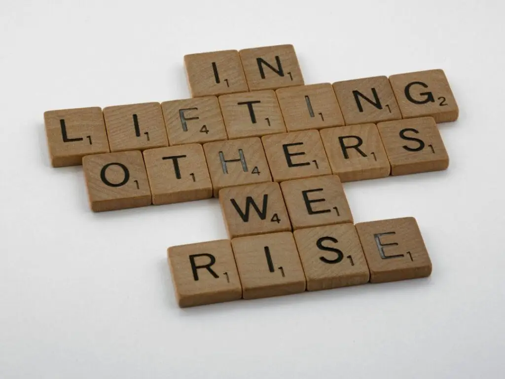 In lifting others, we rise. Motivational quote.
